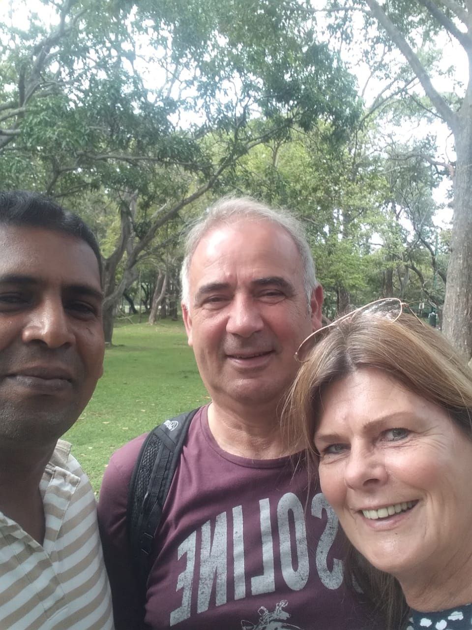 Couple on viewing platform near multi-tiered waterfall – scenic Sri Lanka private tour