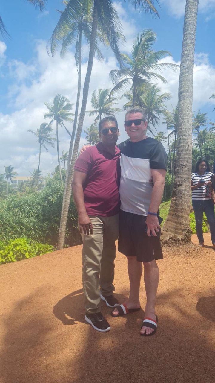 Friends enjoying group selfie near water – authentic Sri Lanka private travel