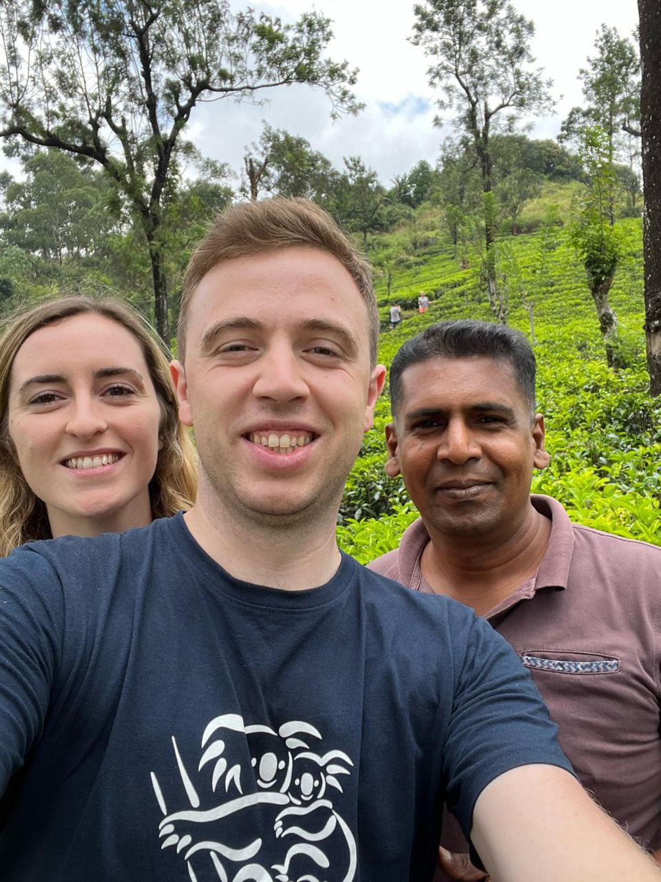 Tourists relaxing under traditional thatched hut – authentic cultural experience Sri Lanka